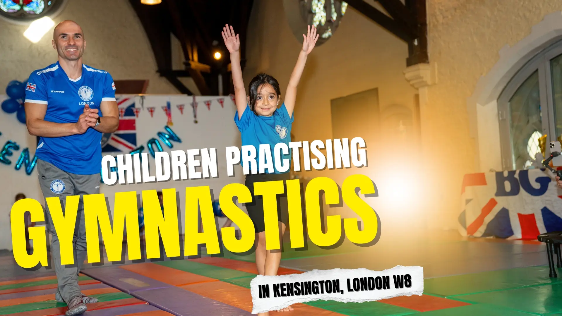 Children practising gymnastics in Kensington with coach Dr. Stefan Kolimechkov at Kensington & Chelsea Gymnastics.