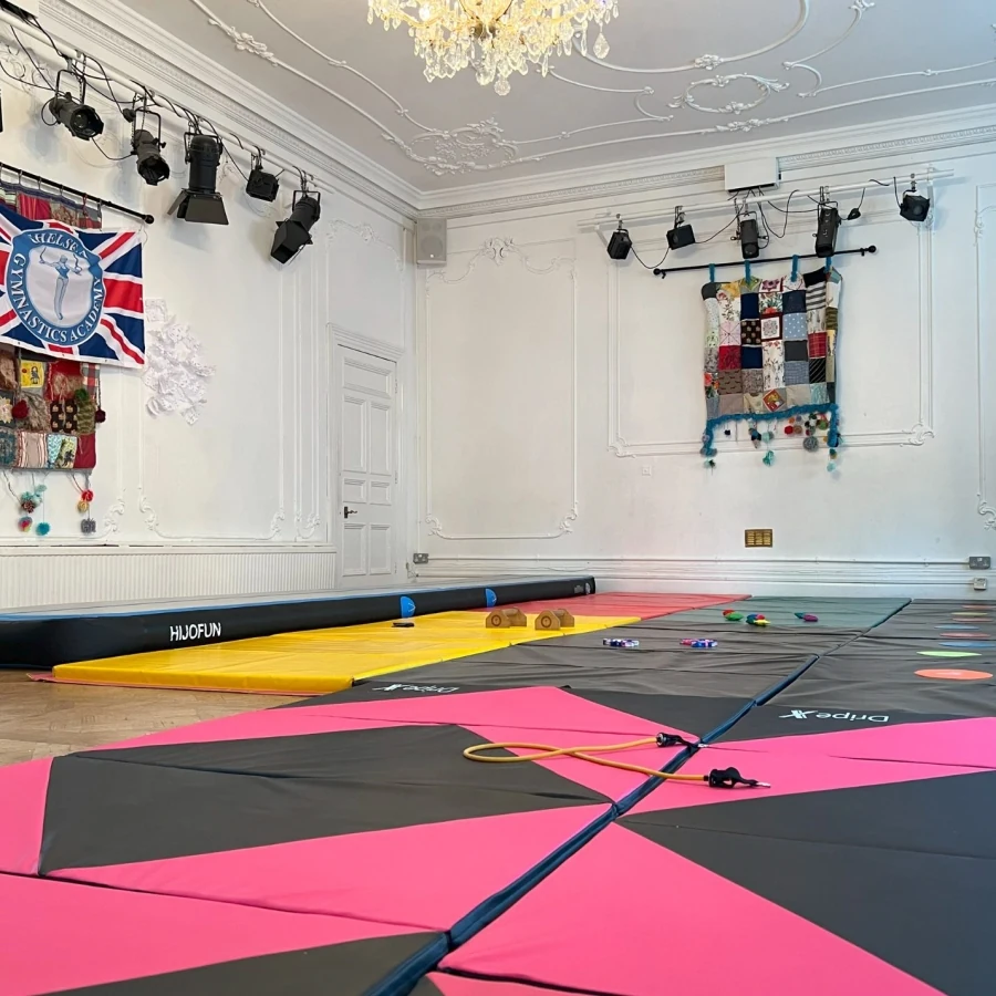 Children celebrating their gymnastics progress with Kensington & Chelsea Gymnastics Academy coaches at More House School in Knightsbridge SW1 London