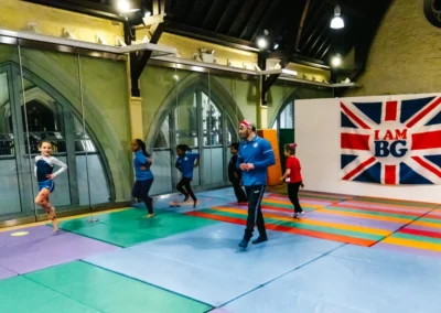 Children warming up with Coach Stefan during the KCGA Christmas Gymnastics Event 2022 in Kensington.