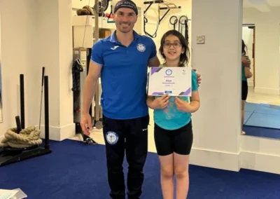 Coach conducting a one-to-one gymnastics lesson with a student at Kensington Studio, part of Kensington & Chelsea Gymnastics Academy in London