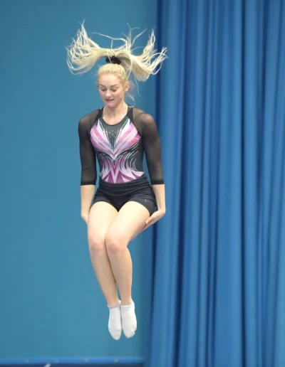 Gymnast Bethany from KCGA performing on trampoline at the 2023 British Gymnastics Adult Championships.