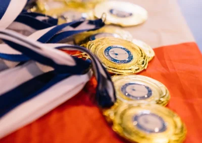 Gold medals prepared for the 2023 Annual Performance at Kensington & Chelsea Gymnastics Academy.