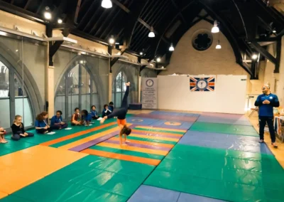 Young gymnast performing handstand at KCGA Easter event in Kensington London W8.