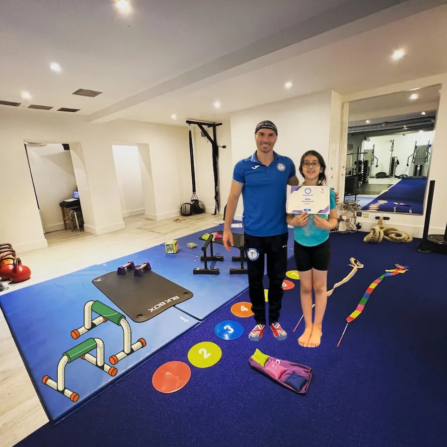 Coach Stefan Kolimechkov standing outside The Kensington Studio in Kensington W8, the private training venue used by Kensington & Chelsea Gymnastics Academy for one-to-one gymnastics lessons.