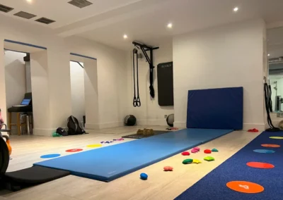 Blue gymnastics mats and training equipment prepared for private gymnastics lessons at The Kensington Studio in Kensington London W8