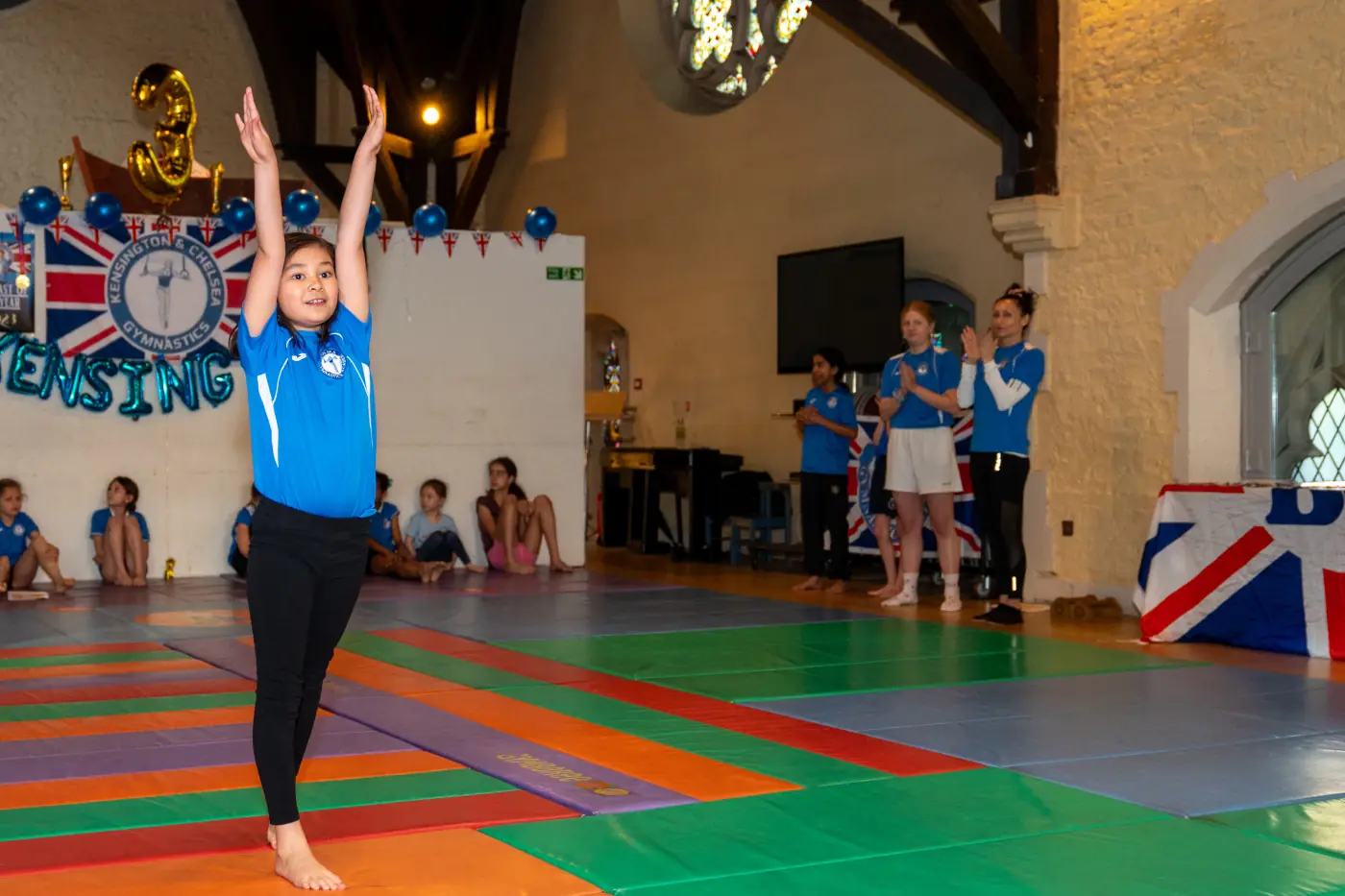 KCGA gymnast performing during a training session at St Philip’s Church, featured in the November 2025 newsletter alongside her parents’ testimonial.