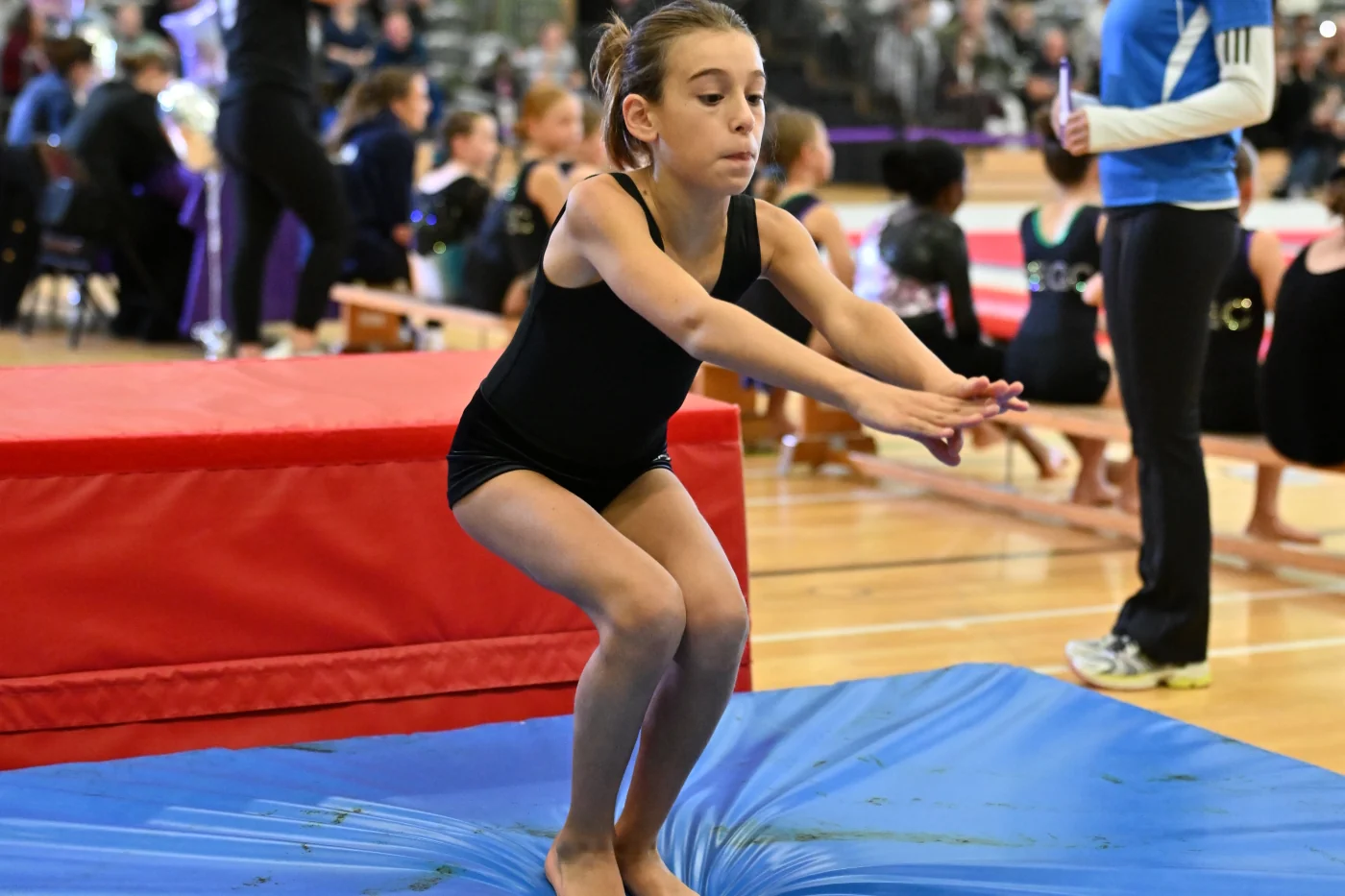 Gigi landing vault during her competition performance at the High 10 Invitational in Essex