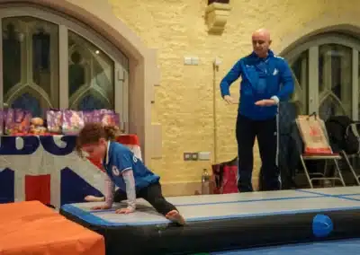 Child practising gymnastics skills on a tumble track at Kensington & Chelsea Gymnastics Academy