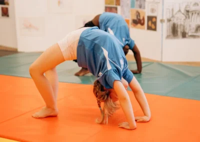 Child performing a bridge during gymnastics classes for children in Knightsbridge London