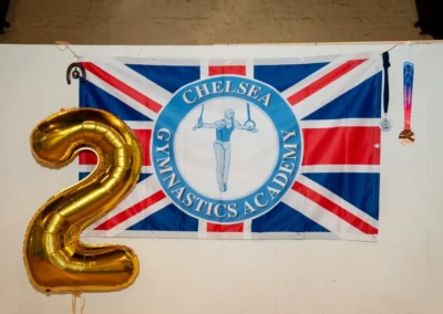Chelsea Gymnastics Academy 2-year anniversary banner at Annual Performance 2024 in Kensington