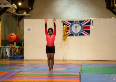 Solo gymnast presenting routine at KCGA Annual Performance 2024 in Kensington London