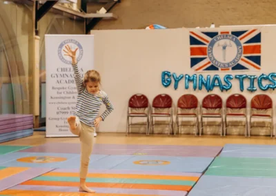 KCGA gymnast performing a one-handed cartwheel during the 2023 Christmas gymnastics showcase at St Philip’s Church in Kensington.
