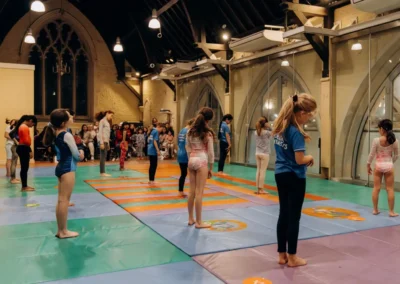 Children warming up during the KCGA Christmas 2023 gymnastics performance at St Philip’s Church in Kensington London.
