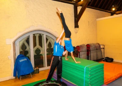 Child practising vault and handstand skills during a private gymnastics lesson at KCGA Easter 2025