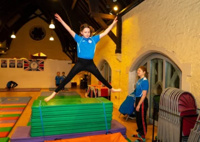 Child performing gymnastics skills on vault during Easter 2025 session at Kensington and Chelsea Gymnastics Academy in London