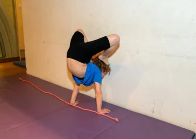 Easter 2025 private gymnastics lesson in Kensington, London – child trains flexibility and control with safe technique at KCGA.