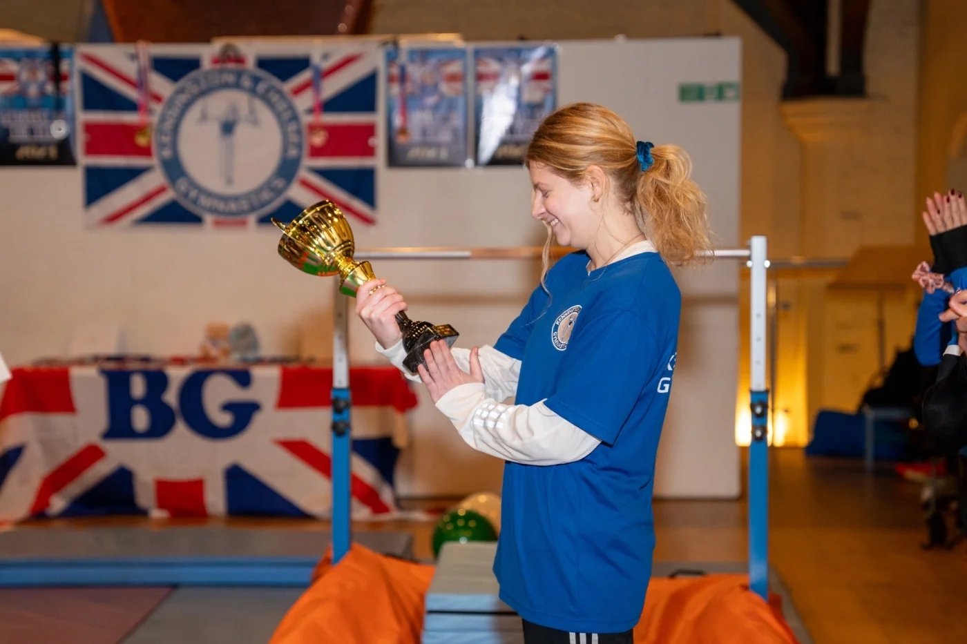 Coach Venia reflecting on her Coach of the Year 2025 award during a KCGA gymnastics session in London.