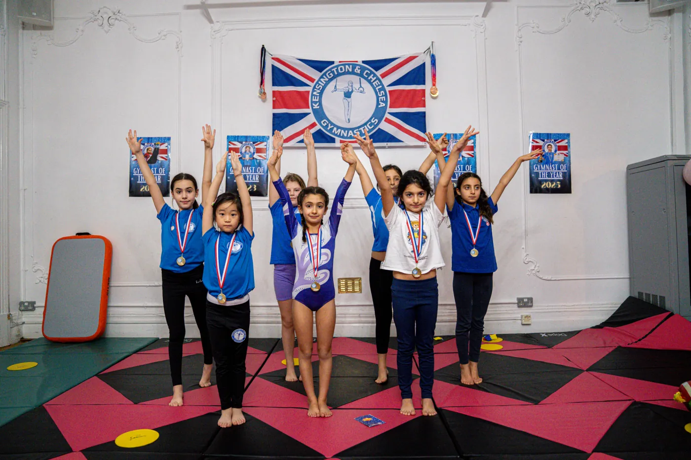 KCGA gymnasts celebrating achievement during a student spotlight session at the Knightsbridge gymnastics location in London SW1X, December 2025.