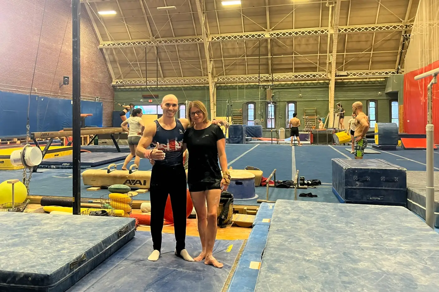 Dr Stefan Kolimechkov with a fellow GB Masters gymnast during warm-up before the 2024 Masters Gymnastics World Cup