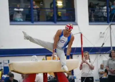 Dr Stefan Kolimechkov performing a pommel horse routine during a Masters artistic gymnastics competition
