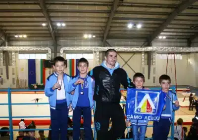 Coach Stefan Kolimechkov with young gymnasts from Levski–08 Sofia after winning medals at the International Gymnastics Tournament “Solachky” in Bulgaria, 2012