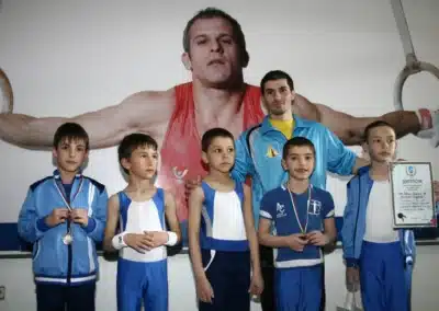 Coach Stefan Kolimechkov with boys’ artistic gymnastics squad after the National Championships qualifications in Bulgaria, 2012