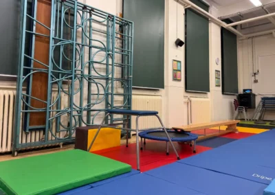 Gymnastics hall at Park Walk School in Chelsea with professional floor mats and equipment set up for children’s classes
