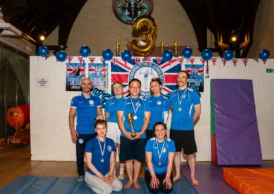 Adult gymnastics team group photo at KCGA Annual Performance in Kensington London