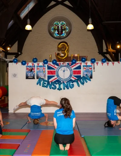 Adult gymnasts practising headstands at the Kensington & Chelsea Gymnastics Academy in London