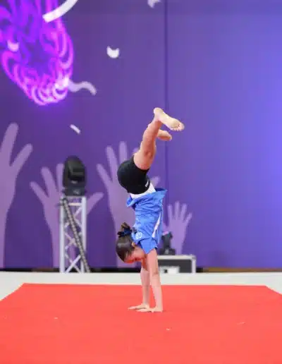 KCGA gymnast performing a cartwheel during her floor routine at the 2025 Essex Invitational.