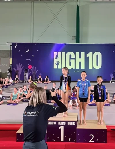 KCGA gymnast Sofia on the podium after winning silver at the 2025 Essex Invitational by High 10 Gymnastics Events.