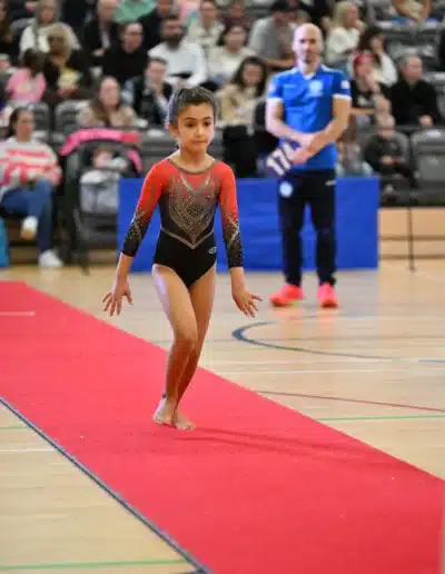 KCGA gymnast Jasmine sprinting during her vault run at the 2025 Essex Invitational.