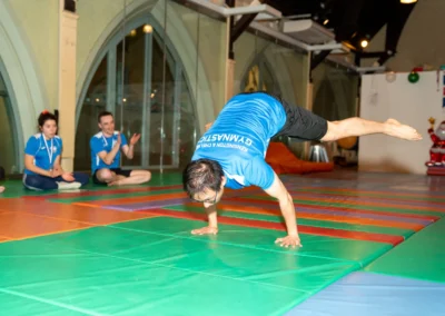 Adult gymnast demonstrating an advanced strength hold during an adult gymnastics class in Kensington London W8.