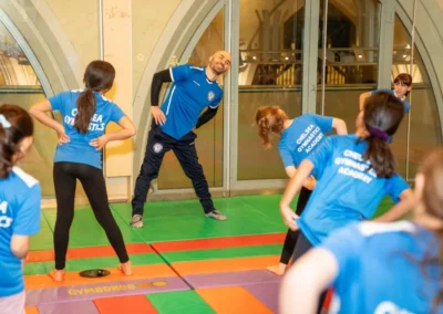 Children warming up together during the KCGA Christmas 2024 event at Kensington Gymnastics Club