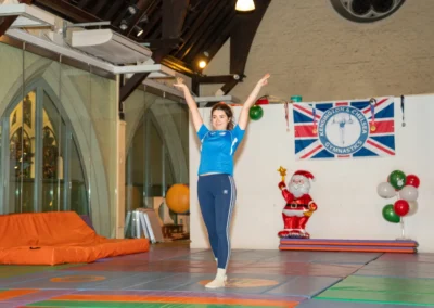 Adult gymnast performing a floor routine during an adult gymnastics class in Kensington, London.
