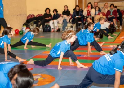 Children developing strength and flexibility during the KCGA Christmas 2024 event at Kensington Gymnastics Club