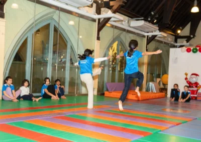 Children practising jumping and coordination during the KCGA Christmas 2024 event at Kensington Gymnastics Club
