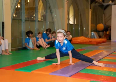 Boys gymnastics class at KCGA Christmas 2024 event in Kensington London performing floor exercises at St Philip’s Church