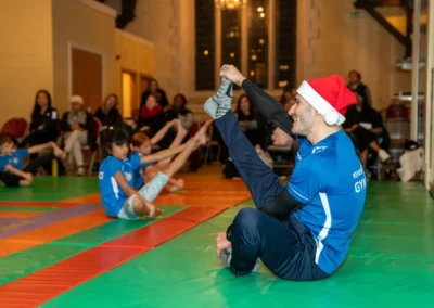 Coach Stefan Kolimechkov leading children’s gymnastics class in Kensington London