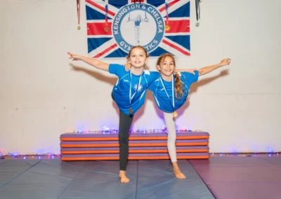 Group of children posing with medals at London gymnastics Christmas celebration