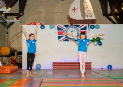 Children learning gymnastics routines at KCGA Christmas event in Kensington London