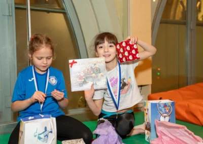 Smiling children at Christmas gymnastics event at St Philip’s Church Kensington London