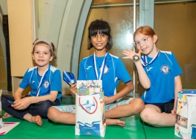 Children winners with certificates and medals at St Philip’s Church Kensington London gymnastics event