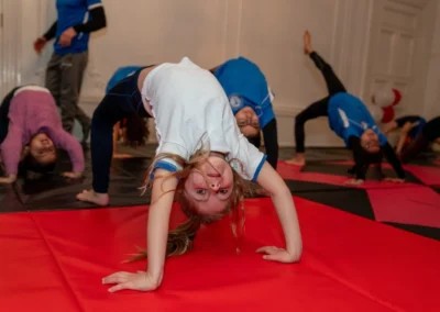 Child performing bridge exercise during gymnastics in Knightsbridge London SW1X