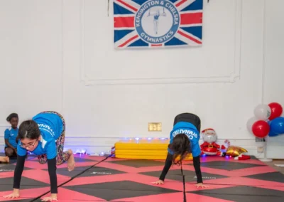 Children performing bunny hops during gymnastics class in Knightsbridge at More House School SW1X