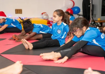 Children stretching during gymnastics class in Knightsbridge at More House School SW1X London