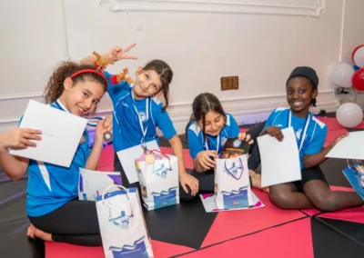 Group of Knightsbridge gymnasts with gift bags and certificates at KCGA Christmas 2024