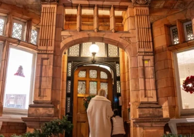 Parents arriving at More House School in Knightsbridge SW1X for children’s gymnastics classes and Christmas 2024 event by KCGA.