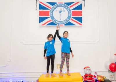 Children celebrating with trophy at Knightsbridge Gymnastics Christmas 2024 at More House School SW1X