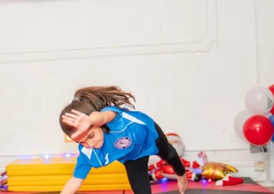 Child performing round-off during Knightsbridge gymnastics class at More House School London